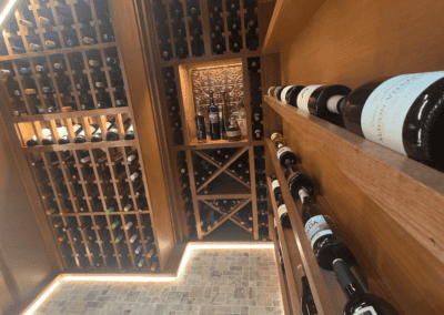 Elegant wine cellar with wooden racks and ambient lighting at Example Co.